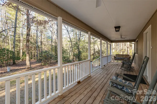 a view of a porch with wooden floor outdoor seating