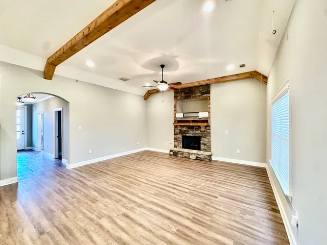 a kitchen with stainless steel appliances granite countertop a sink stove and wooden floor