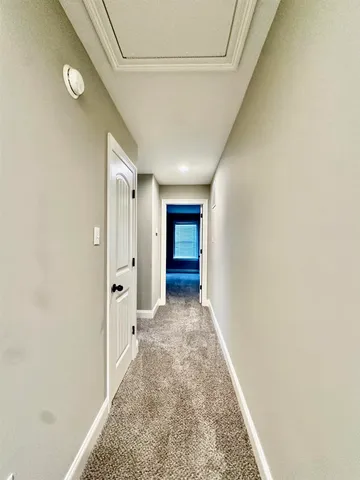 an empty room with a empty space and windows