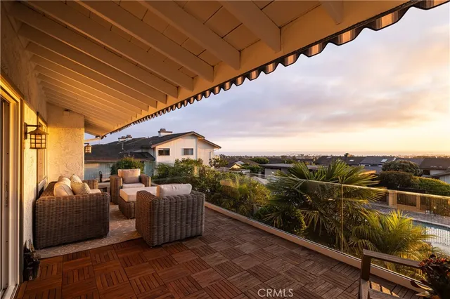 a view of roof deck with furniture