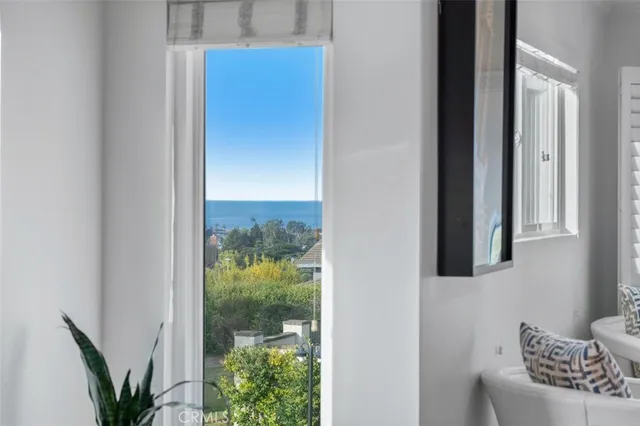 a view of a door and chair in the balcony