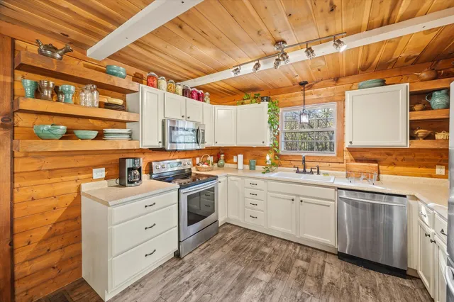 a view of a kitchen with cabinets