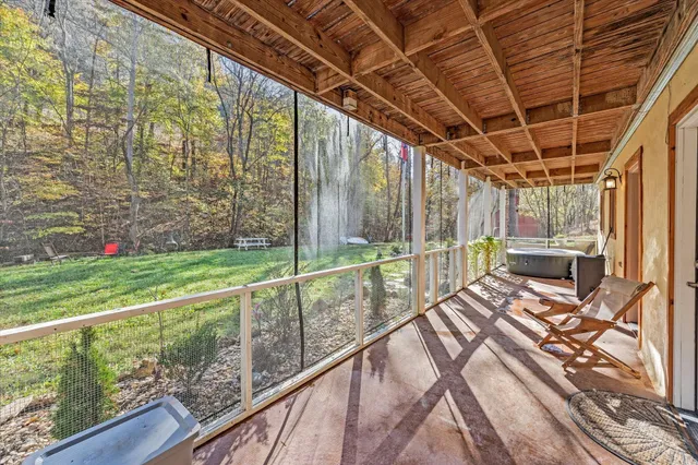 a view of balcony with wooden floor