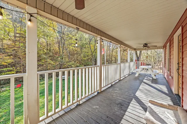 a view of a balcony with wooden floor
