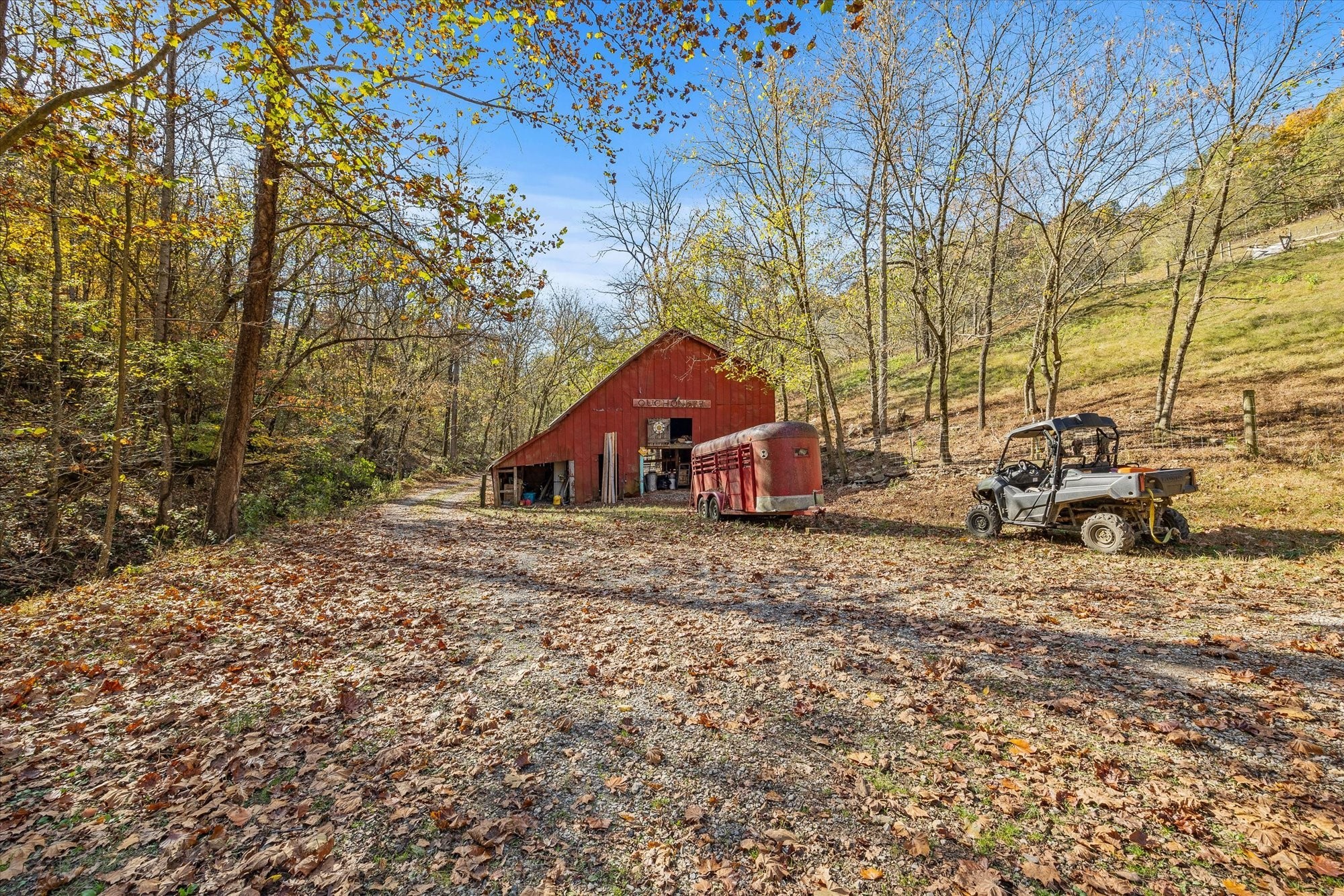 89 Ouchonder Road Elmwood, TN 38560 - Photo 37 of 50 a house with trees in the background