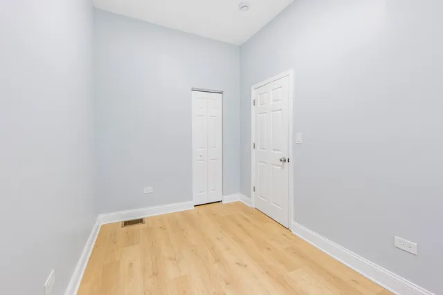 a view of a big room with wooden floor