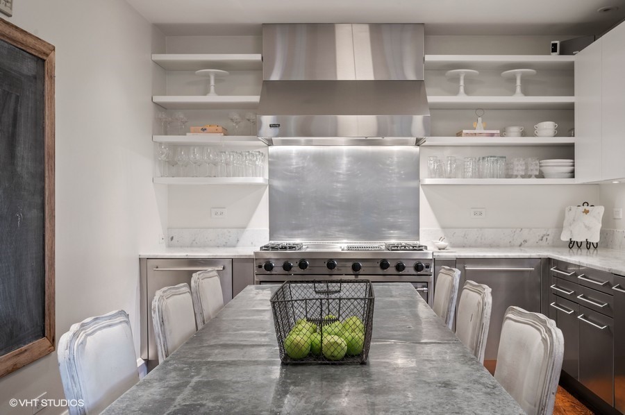 111 Robsart Road Kenilworth, IL 60043 - Photo 12 of 49 a kitchen with a stove and a refrigerator