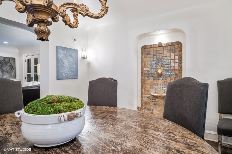 111 Robsart Road Kenilworth, IL 60043 - Photo 18 of 49 a view of a room with a potted plant and wooden floor