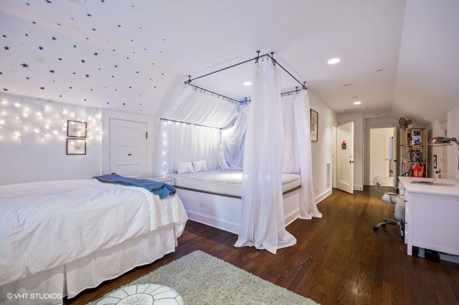 111 Robsart Road Kenilworth, IL 60043 - Photo 32 of 49 a spacious bedroom with a bed and a view of living room