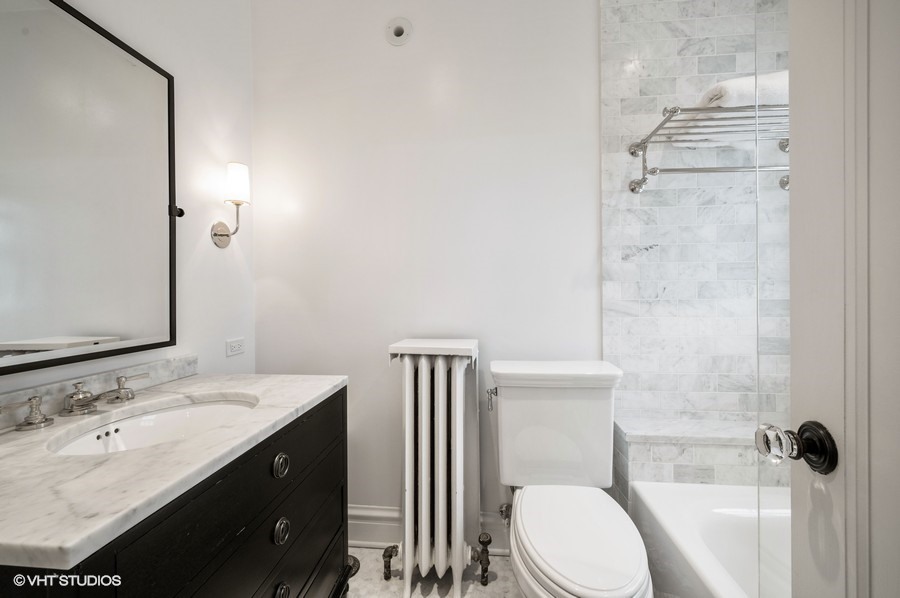 111 Robsart Road Kenilworth, IL 60043 - Photo 35 of 49 a bathroom with a sink a toilet and shower