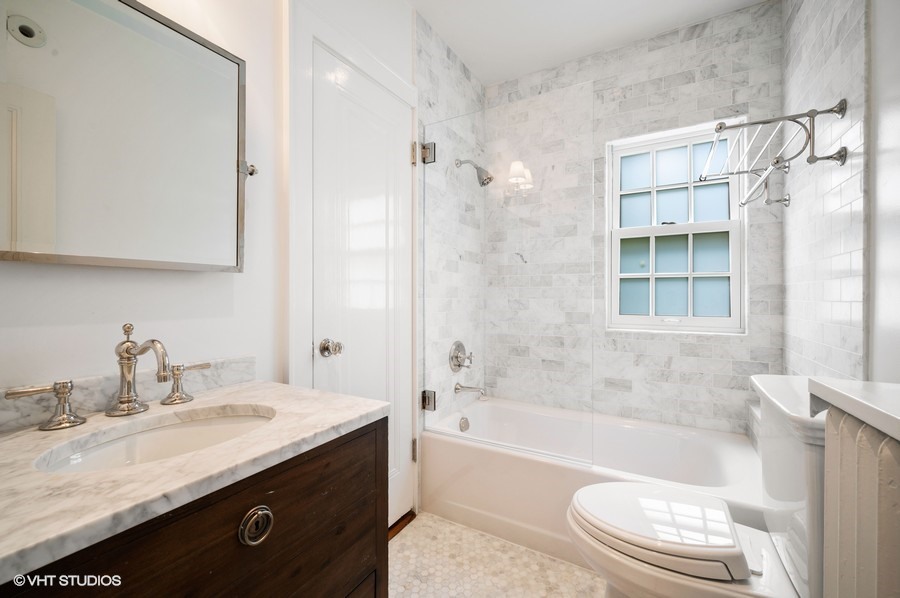 111 Robsart Road Kenilworth, IL 60043 - Photo 36 of 49 a bathroom with a granite countertop sink toilet and shower