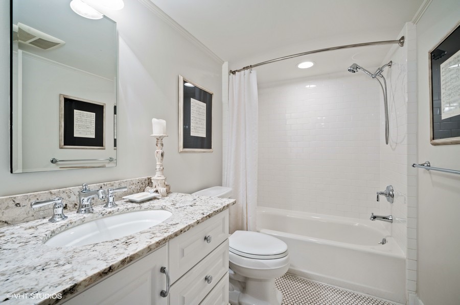 111 Robsart Road Kenilworth, IL 60043 - Photo 38 of 49 a bathroom with a granite countertop sink toilet and shower