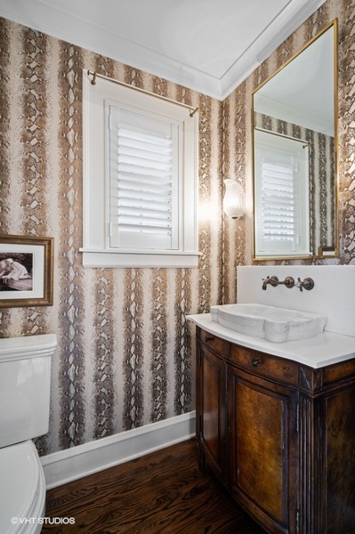 111 Robsart Road Kenilworth, IL 60043 - Photo 41 of 49 a bathroom with a granite countertop sink a toilet and a mirror