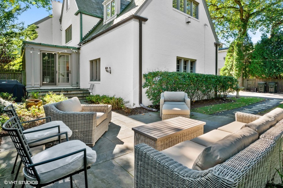 111 Robsart Road Kenilworth, IL 60043 - Photo 46 of 49 a view of a patio with couches chairs and a yard