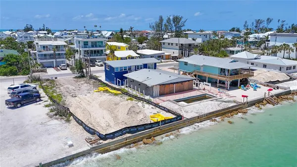 a view of swimming pool with outdoor seating space