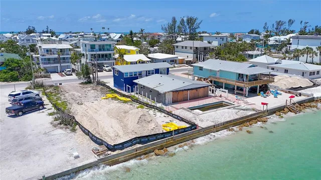 a view of swimming pool with outdoor seating space