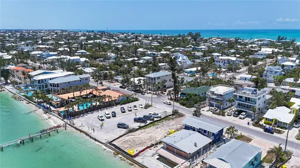 an aerial view of a city with ocean view