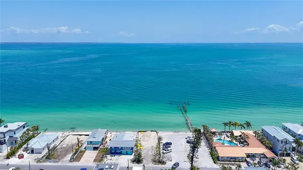 an aerial view of a house with a ocean view