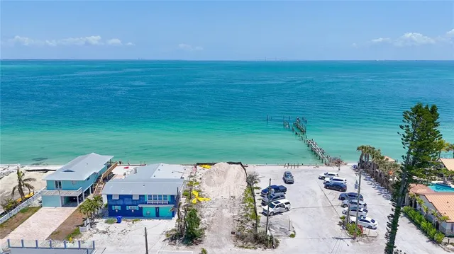 an aerial view of a house with a ocean view