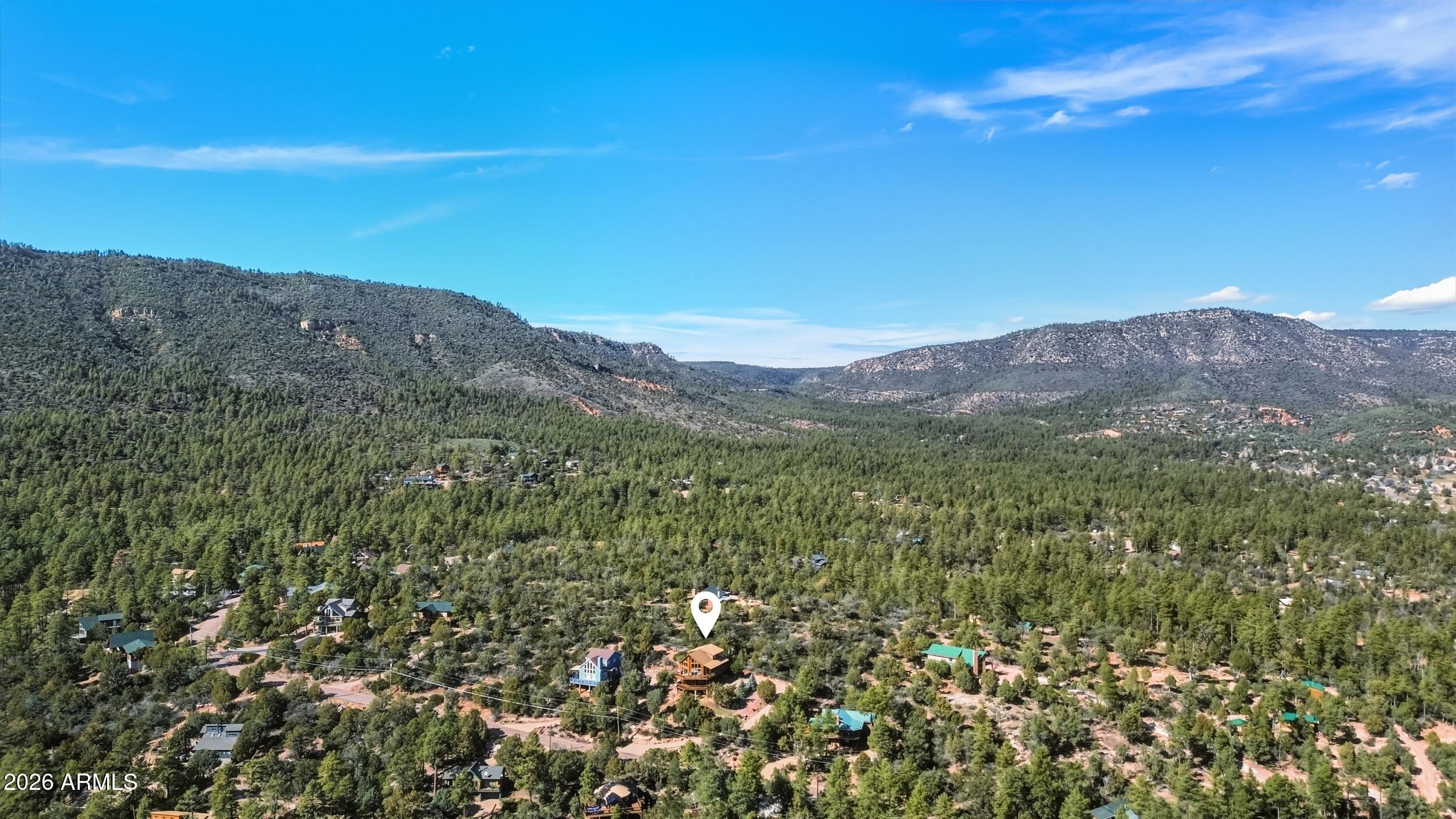 3119 Kysar Way Pine, AZ 85544 - Photo 57 of 68 a view of a lush green field with mountains in the background
