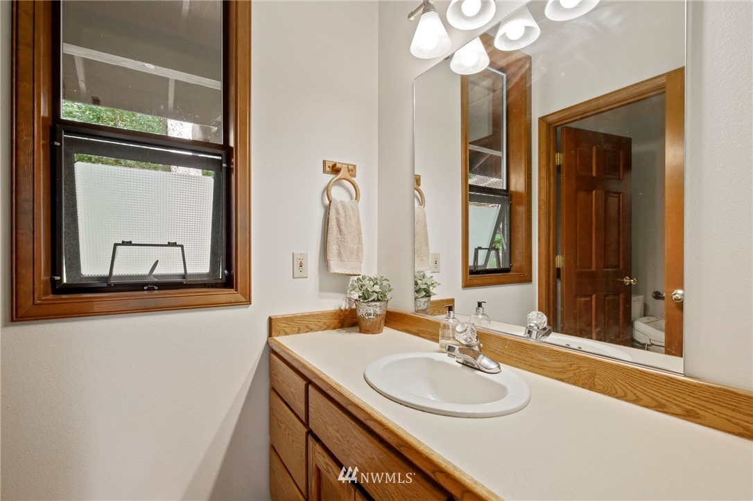20830 Southeast 145th Street Renton, WA 98059 - Photo 11 of 39 a bathroom with a sink and a mirror
