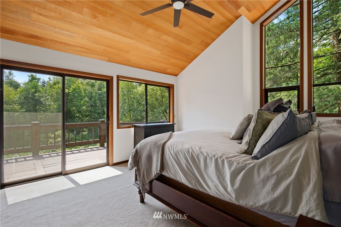 20830 Southeast 145th Street Renton, WA 98059 - Photo 13 of 39 a bedroom with furniture and large windows