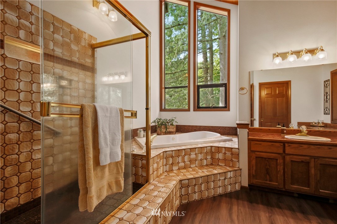 20830 Southeast 145th Street Renton, WA 98059 - Photo 17 of 39 a bathroom with a tub sink and mirror