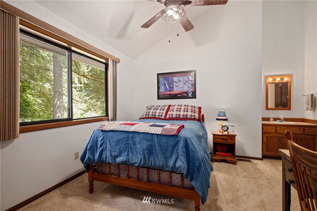 20830 Southeast 145th Street Renton, WA 98059 - Photo 20 of 39 a bedroom with a bed and a dresser next to a window
