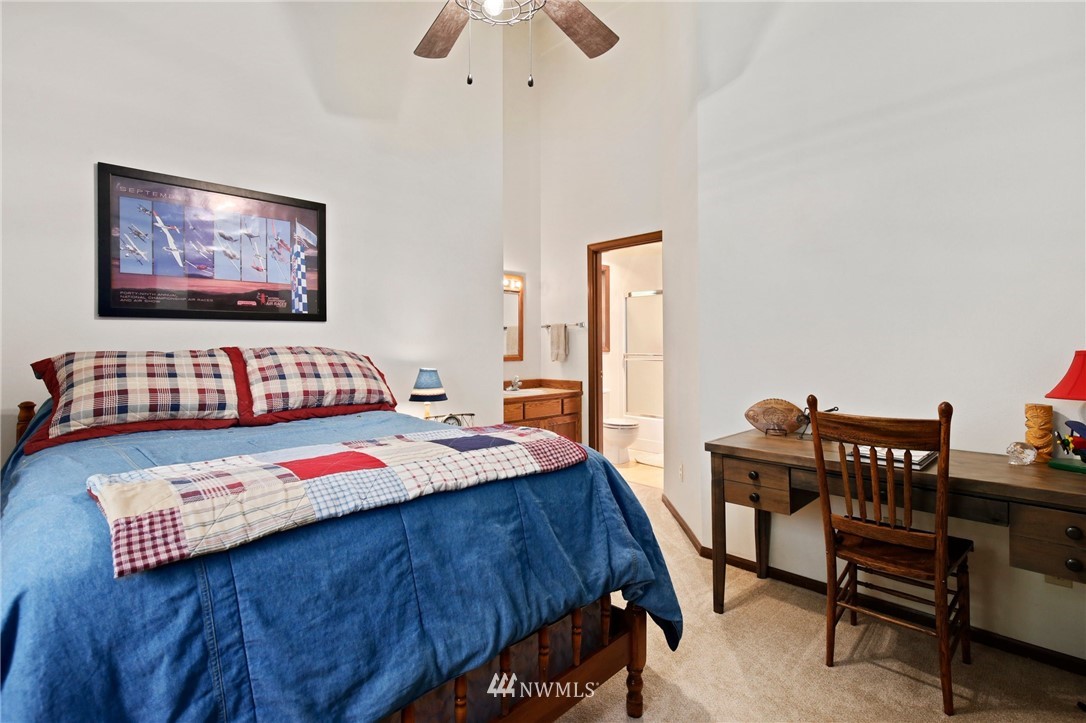 20830 Southeast 145th Street Renton, WA 98059 - Photo 21 of 39 a bedroom with a bed and a desk
