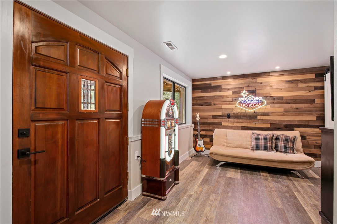 20830 Southeast 145th Street Renton, WA 98059 - Photo 22 of 39 a bedroom with furniture and wooden floor