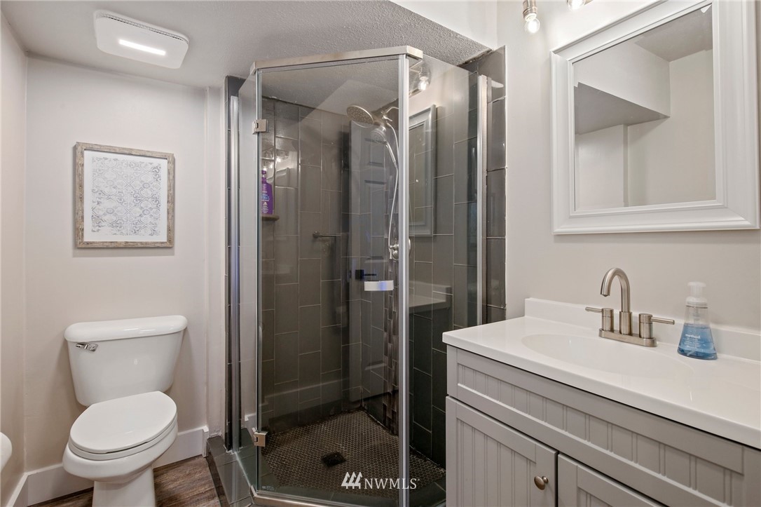 20830 Southeast 145th Street Renton, WA 98059 - Photo 24 of 39 a bathroom with a sink a toilet and shower