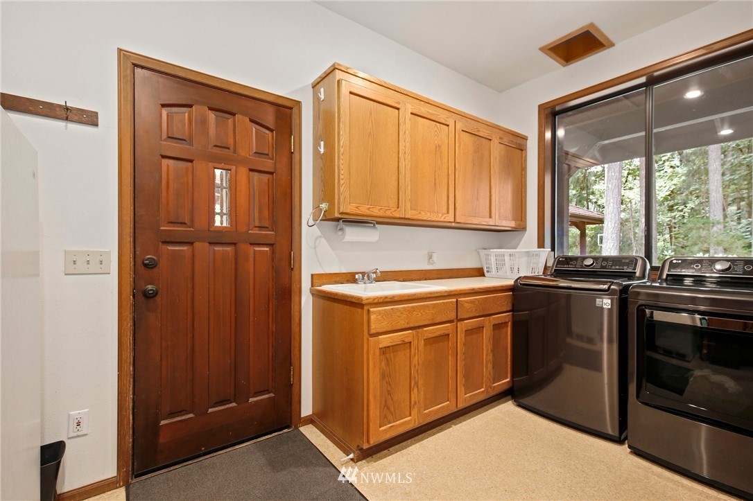 20830 Southeast 145th Street Renton, WA 98059 - Photo 25 of 39 a kitchen with a refrigerator stove and sink