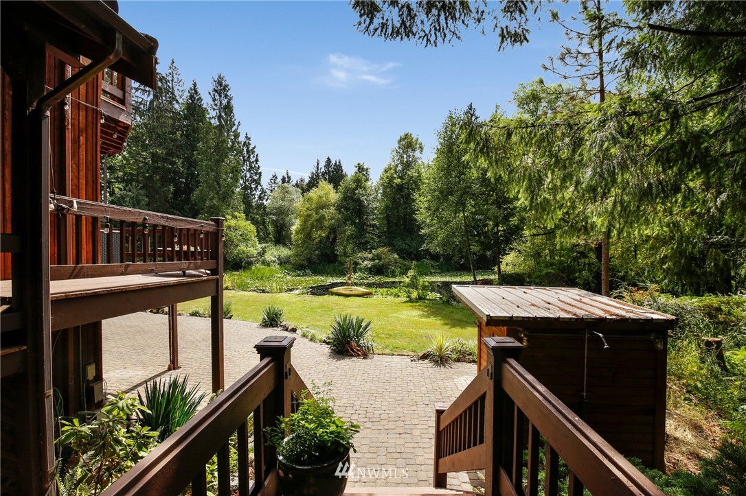 20830 Southeast 145th Street Renton, WA 98059 - Photo 28 of 39 a view of a wooden deck and a patio with swimming pool