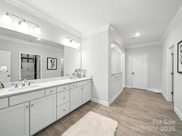 a front view of a house with a yard and a garage