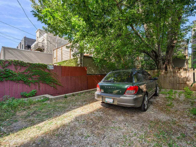 a car parked in front of a house