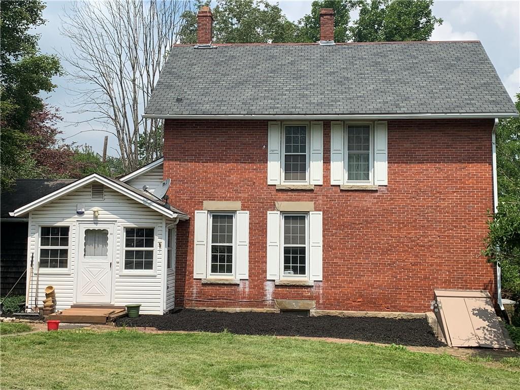 168 Boozel Road Slippery Rock, PA 16057 - Photo 2 of 24 a front view of a house with a yard