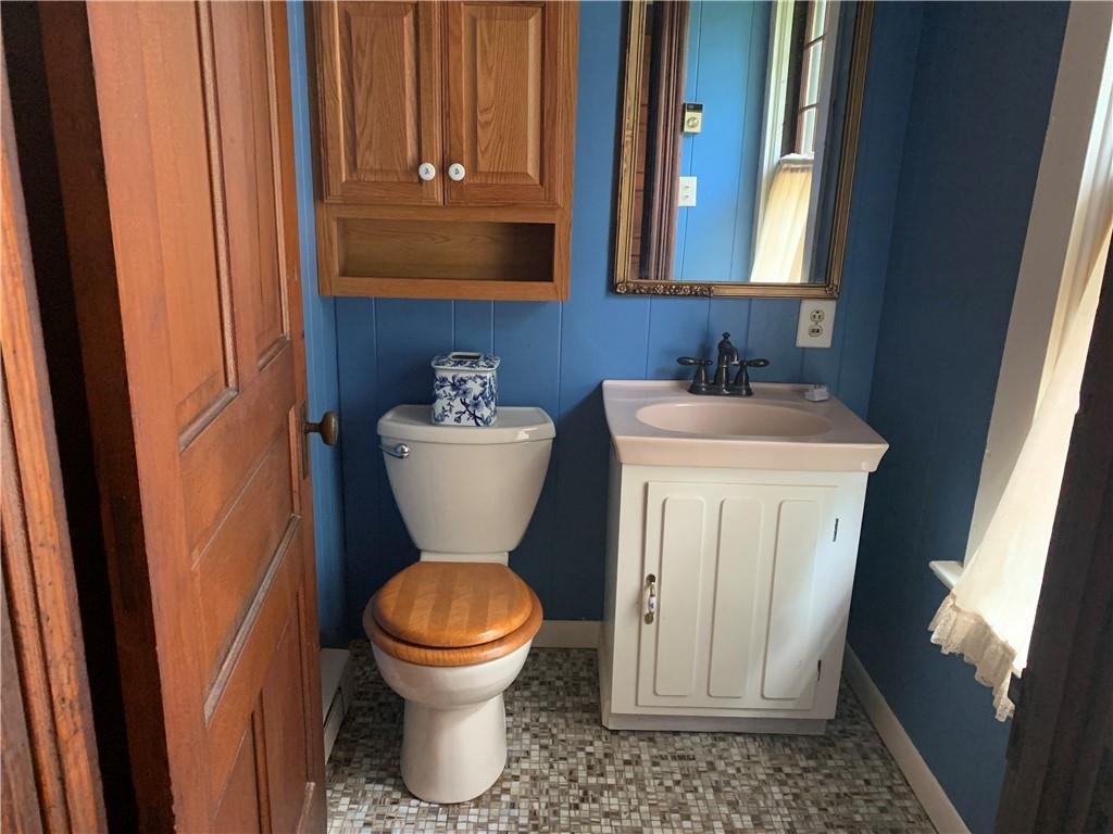 168 Boozel Road Slippery Rock, PA 16057 - Photo 12 of 24 a bathroom with a toilet sink and mirror
