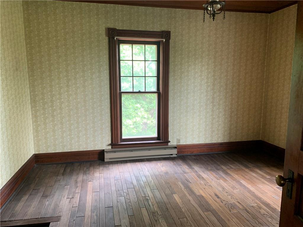 168 Boozel Road Slippery Rock, PA 16057 - Photo 15 of 24 an empty room with wooden floor and windows