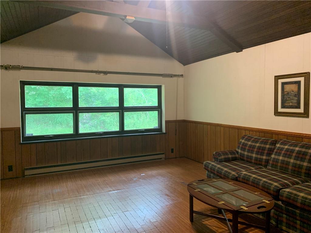 168 Boozel Road Slippery Rock, PA 16057 - Photo 8 of 24 an empty room with wooden floor and windows