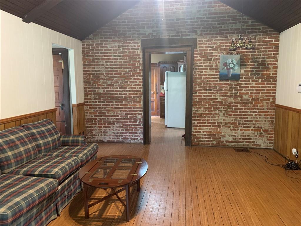 168 Boozel Road Slippery Rock, PA 16057 - Photo 9 of 24 a view of a door with wooden bench