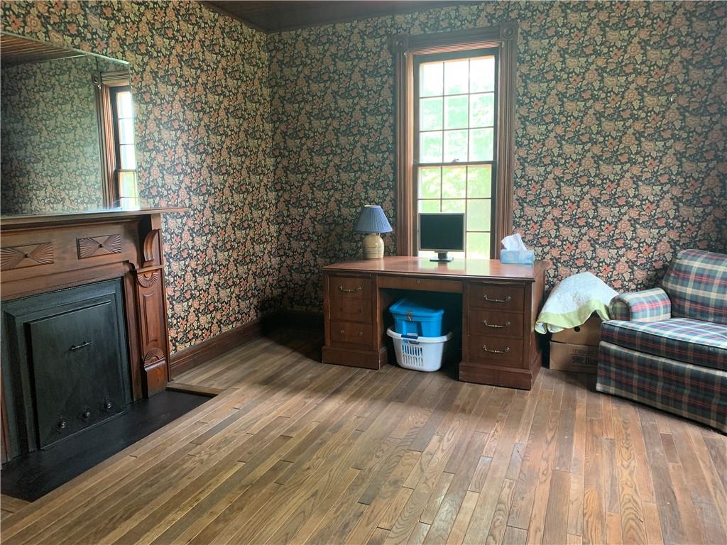 168 Boozel Road Slippery Rock, PA 16057 - Photo 10 of 24 a view of a livingroom with a fireplace and window