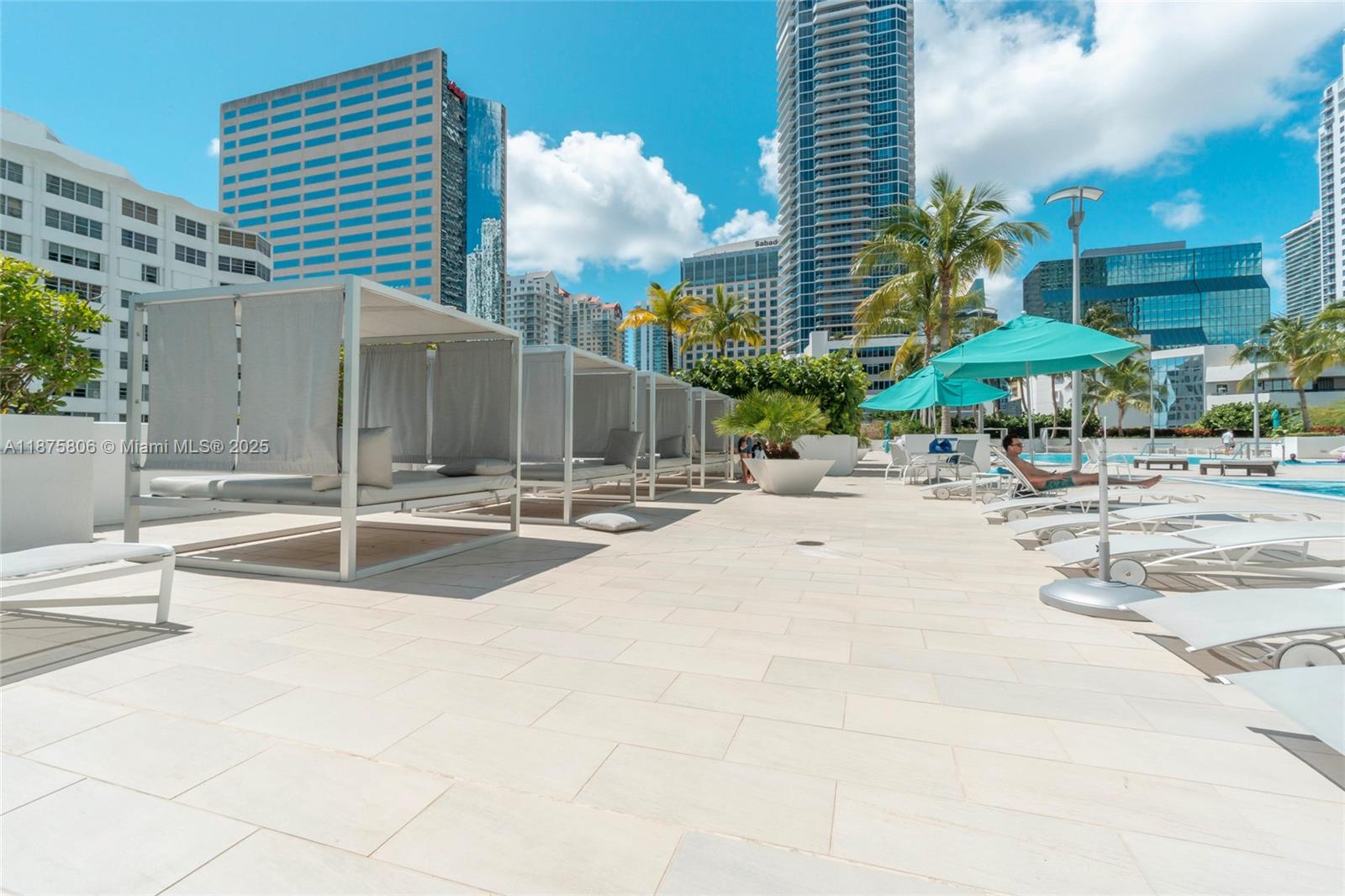951 Brickell Avenue, Unit 1010 Miami, FL 33131 - Photo 17 of 23 a swimming pool with outdoor seating and yard
