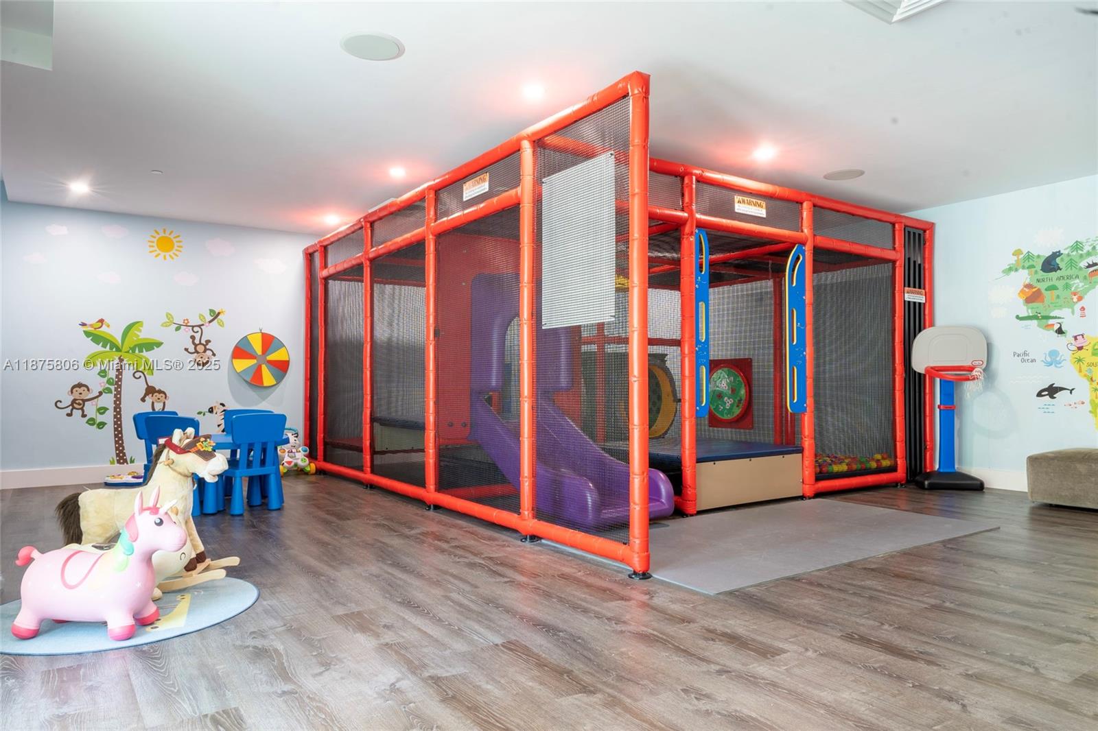 951 Brickell Avenue, Unit 1010 Miami, FL 33131 - Photo 22 of 23 a utility room with stainless steel appliances wooden floor and a view of living room