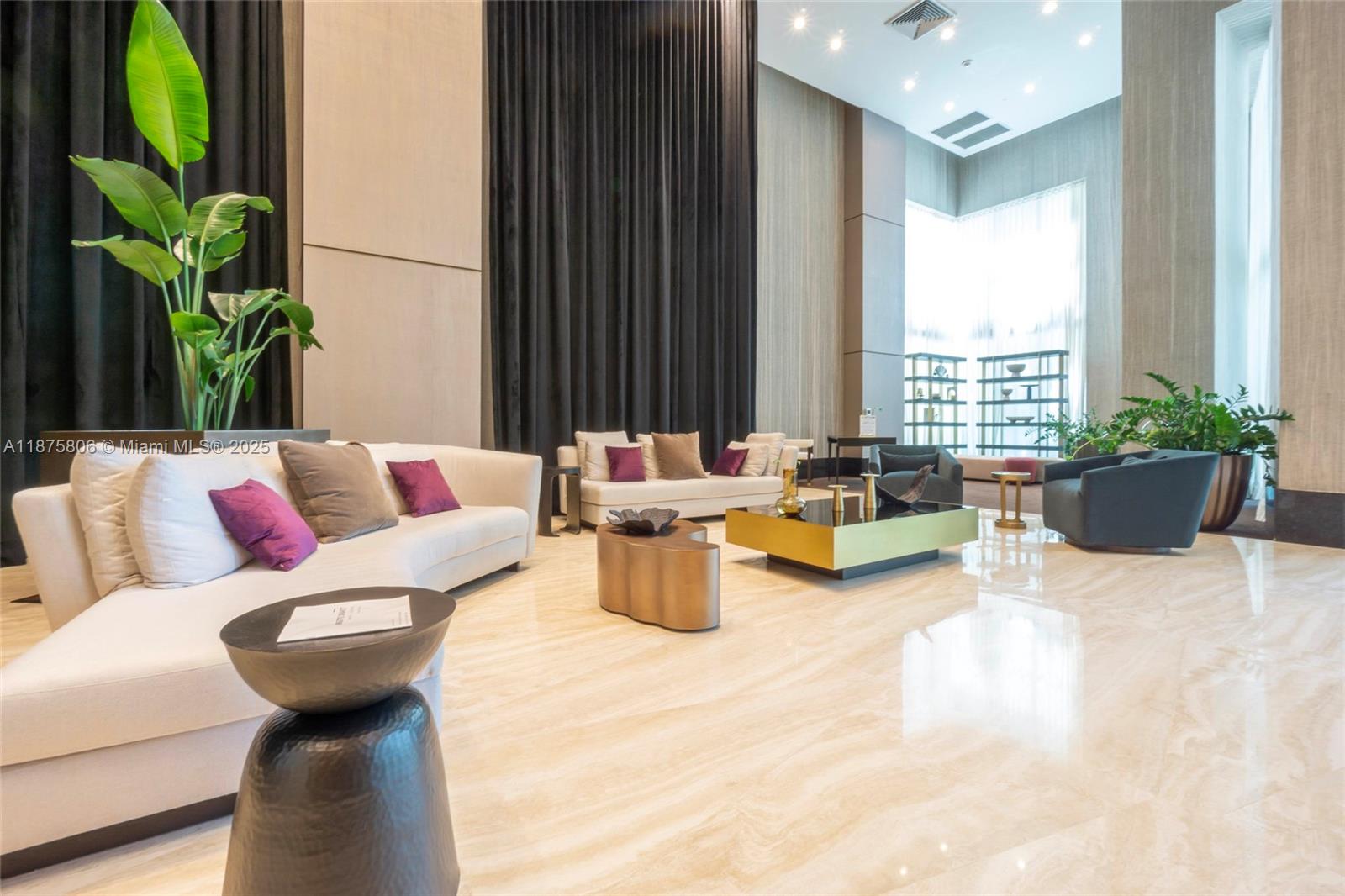 951 Brickell Avenue, Unit 1010 Miami, FL 33131 - Photo 23 of 23 a living room with furniture and a potted plant