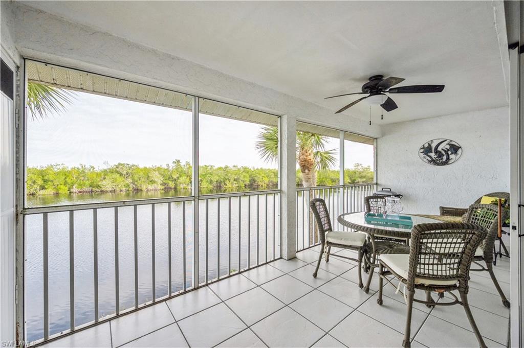 1325 Mainsail Drive, Unit 1213 Naples, FL 34114 - Photo 18 of 40 a view of a dining room with furniture window and outside view