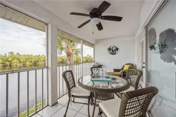 a dining room with furniture a window and outside view