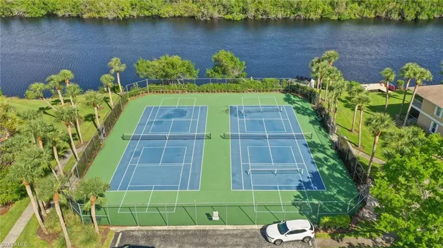 a view of a lake with a bench next to a lake