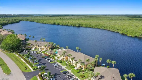 a view of a lake with a yard