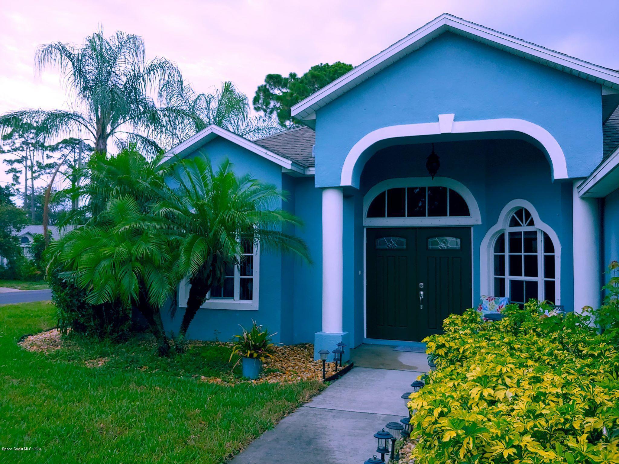 6791 Hartford Road Cocoa, FL 32927 - Photo 2 of 43 a view of a house with a yard