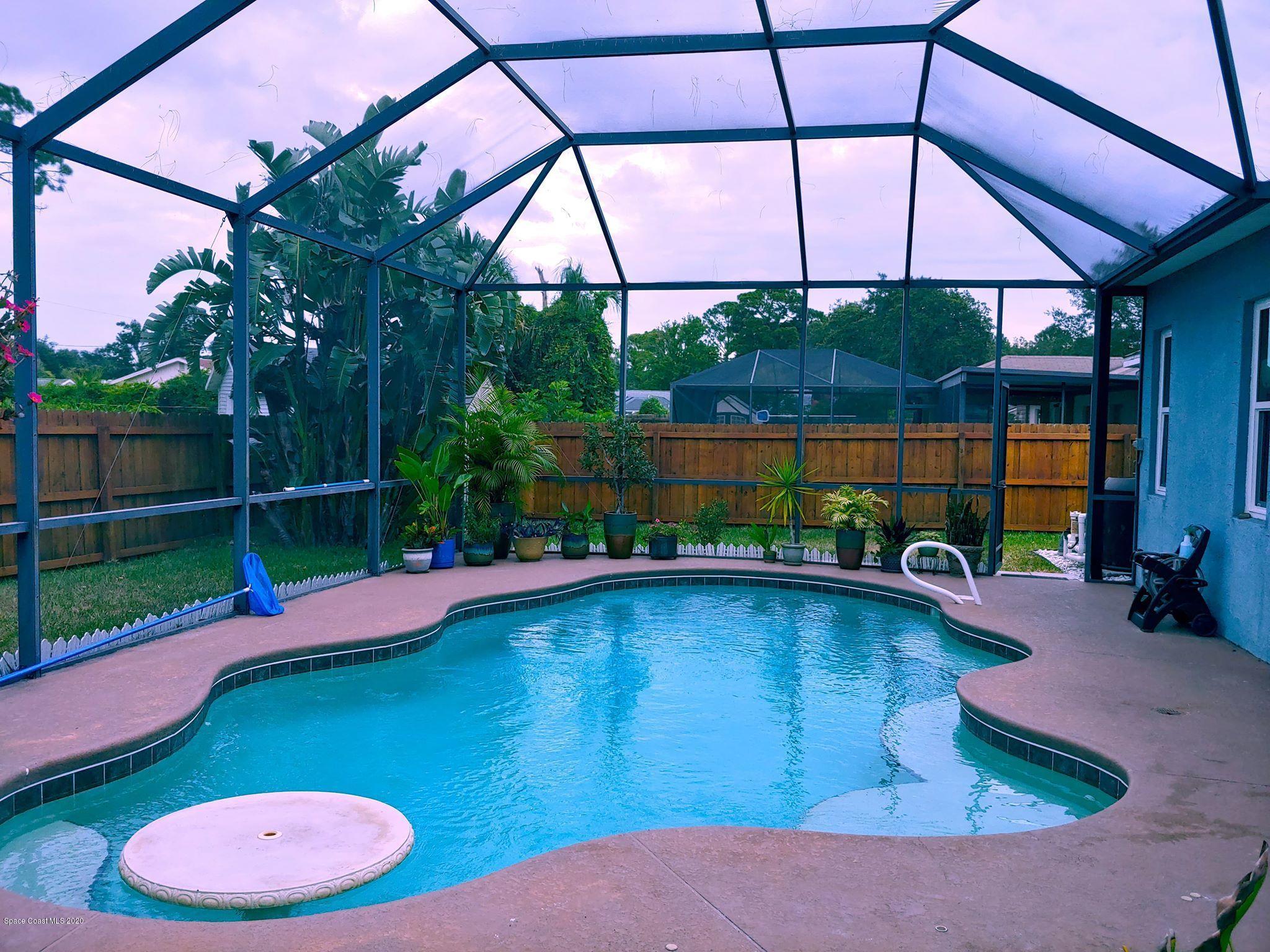 6791 Hartford Road Cocoa, FL 32927 - Photo 3 of 43 a view of a backyard with swimming pool and furniture